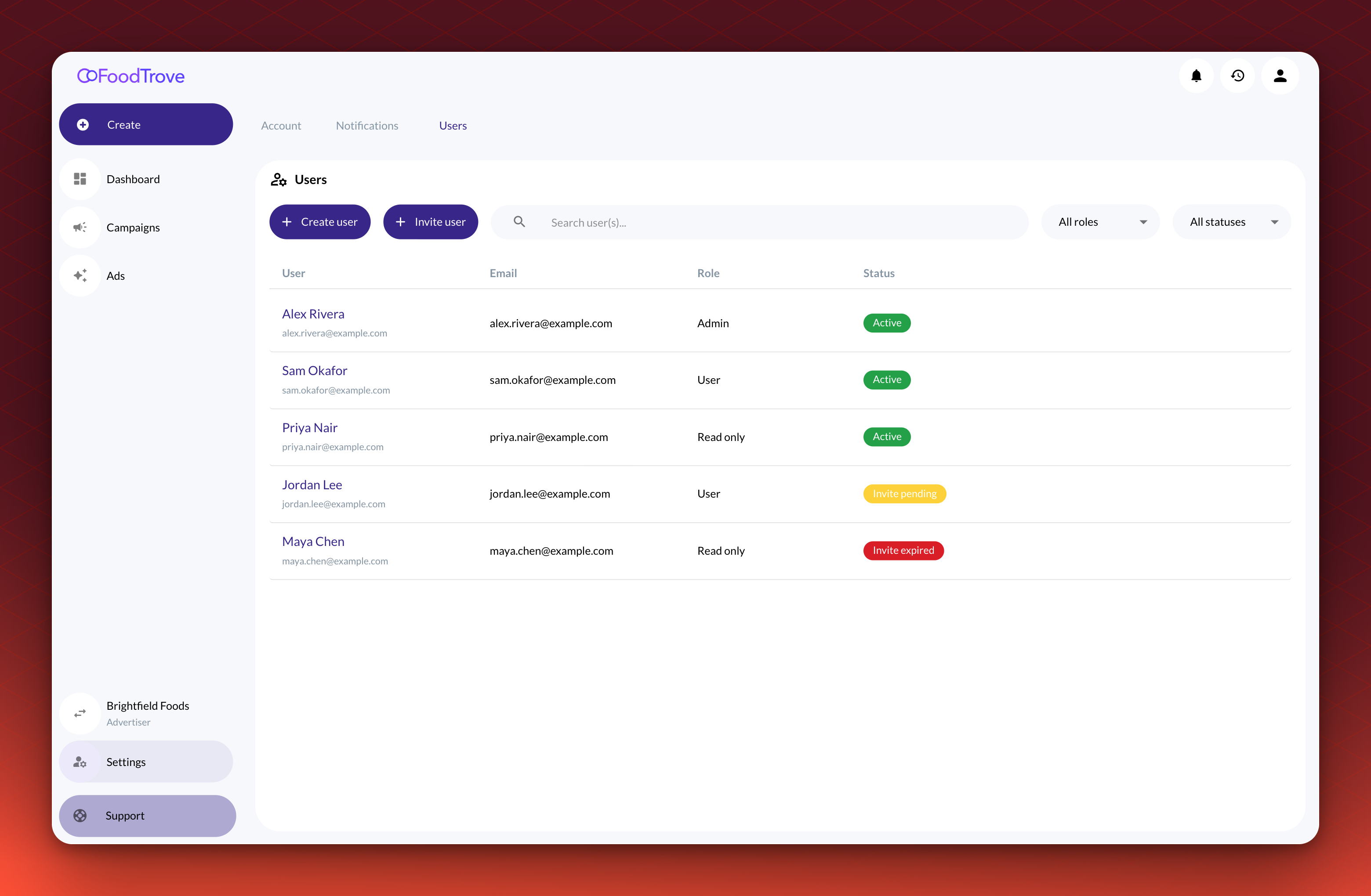 The Users tab under Settings for an advertiser. Settings is highlighted in the sidebar, and the list shows five users with their roles and statuses, with Create user and Invite user buttons above it.