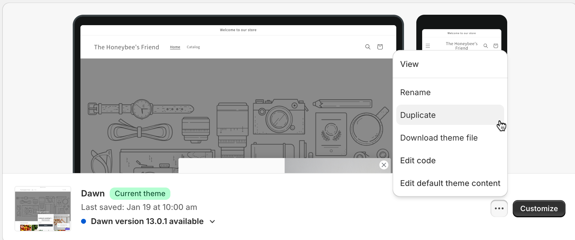 Shopify themes editor menu opened with "Duplicate" option shown on a theme