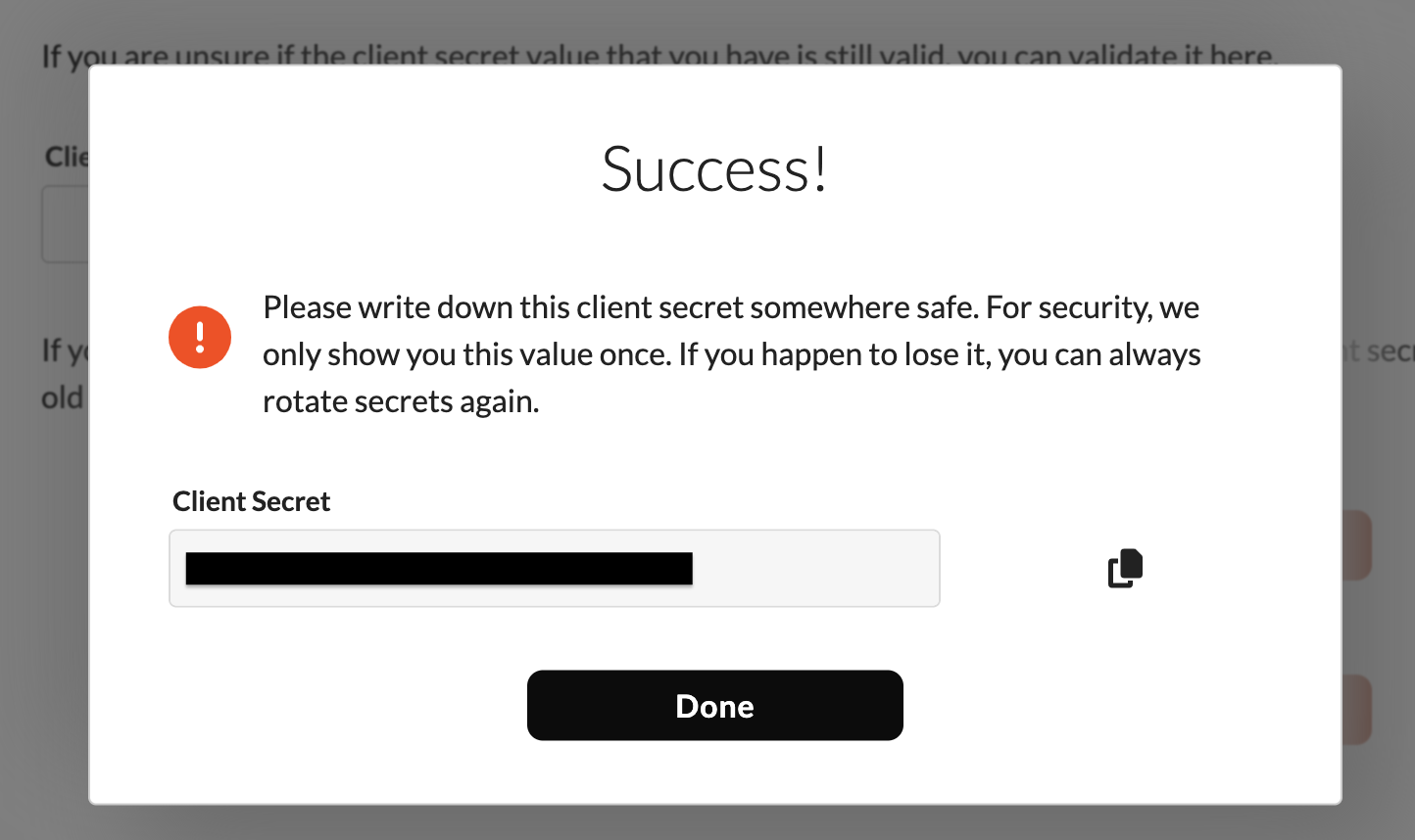 Success dialog showing the new client secret after rotation.