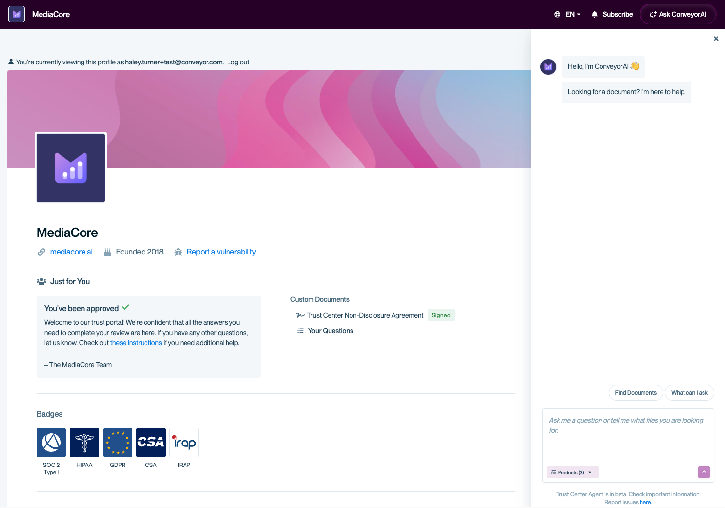 Trust Center page for “MediaCore” showing an authenticated visitor with a signed NDA. The right-side Trust Center Agent panel is open and displays the onboarding messages “Hello, I’m ConveyorAI 👋” and “Looking for a document? I’m here to help.” The chat input is active, with buttons for “Find Documents,” “What can I ask,” and a product selector.