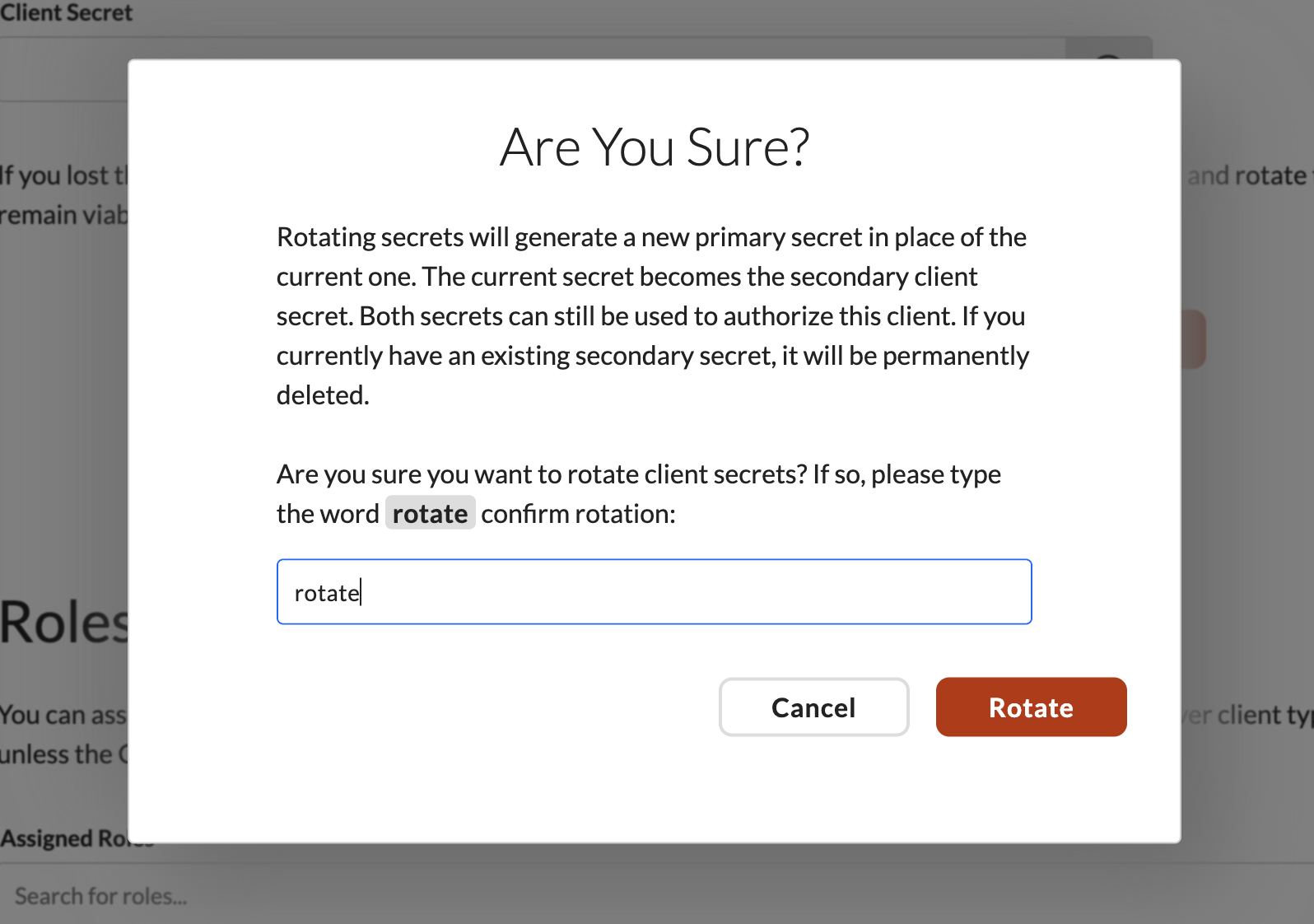 Are You Sure confirmation modal for rotating the client secret, requiring the word rotate to be typed to confirm.