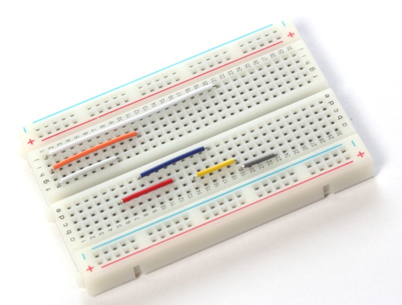 Pins on breadboard connected using smaller jumper wires.