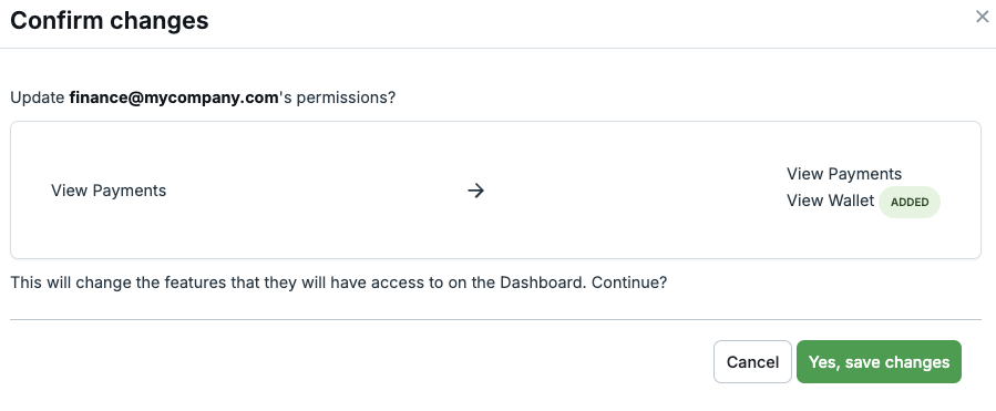 Confirm changes modal showing role diff with added and removed badges