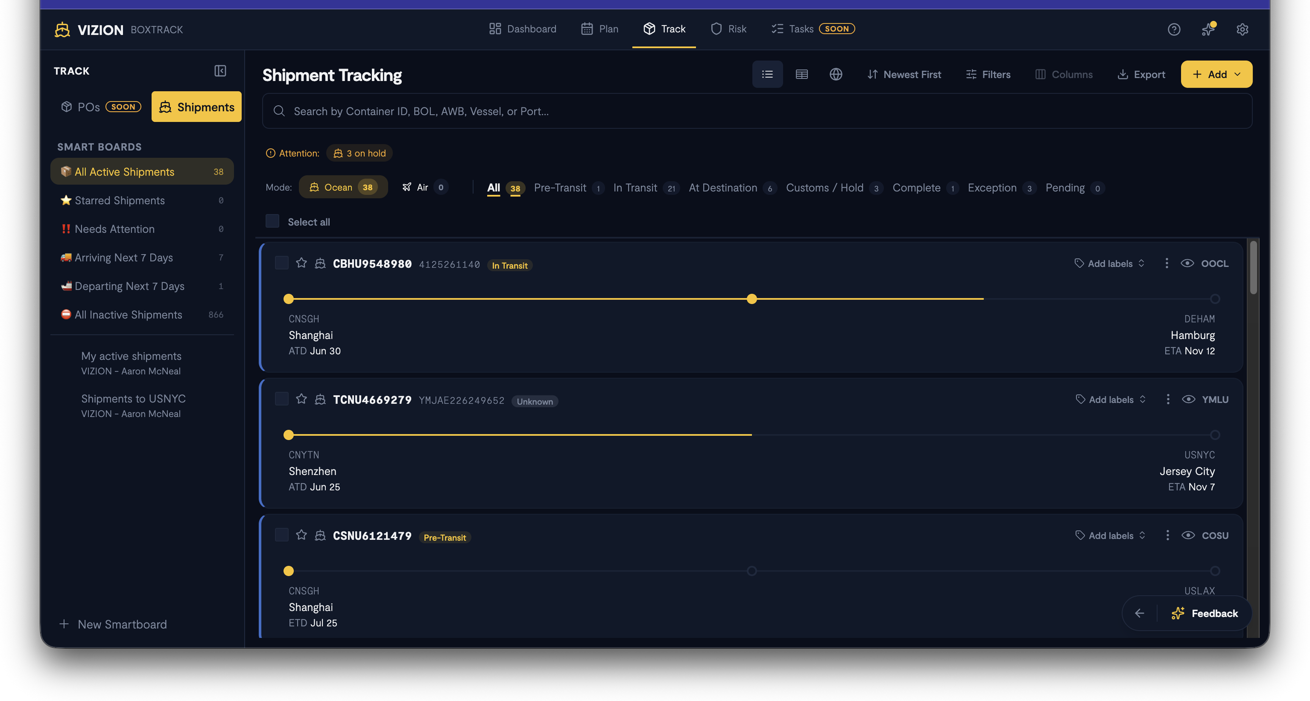 Screenshot: Full Track page showing the Smart Boards sidebar on the left (All Active Shipments, Starred, Needs Attention, Arriving/Departing Next 7 Days), transport mode toggle (Ocean/Air), status filter tabs with counts, and the shipment list in card/list view with progress bars, origin/destination, dates, and carrier info