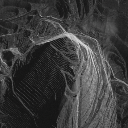 Bingham open pit mine - shadows north make the mine look elevated.