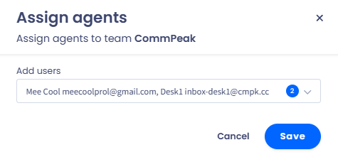 A screenshot of the dialog showing a message to confirm assigning an agent to an inbox team 'CommPeak' and the 'Save' and 'Cancel' buttons.