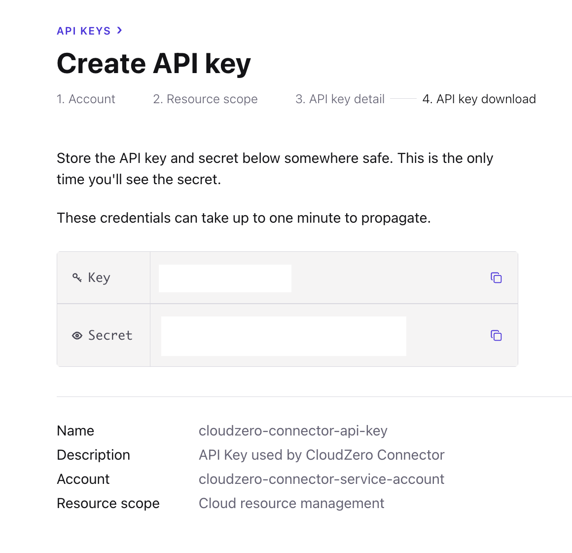 Confluent displays the API key and secret you created for the service account.