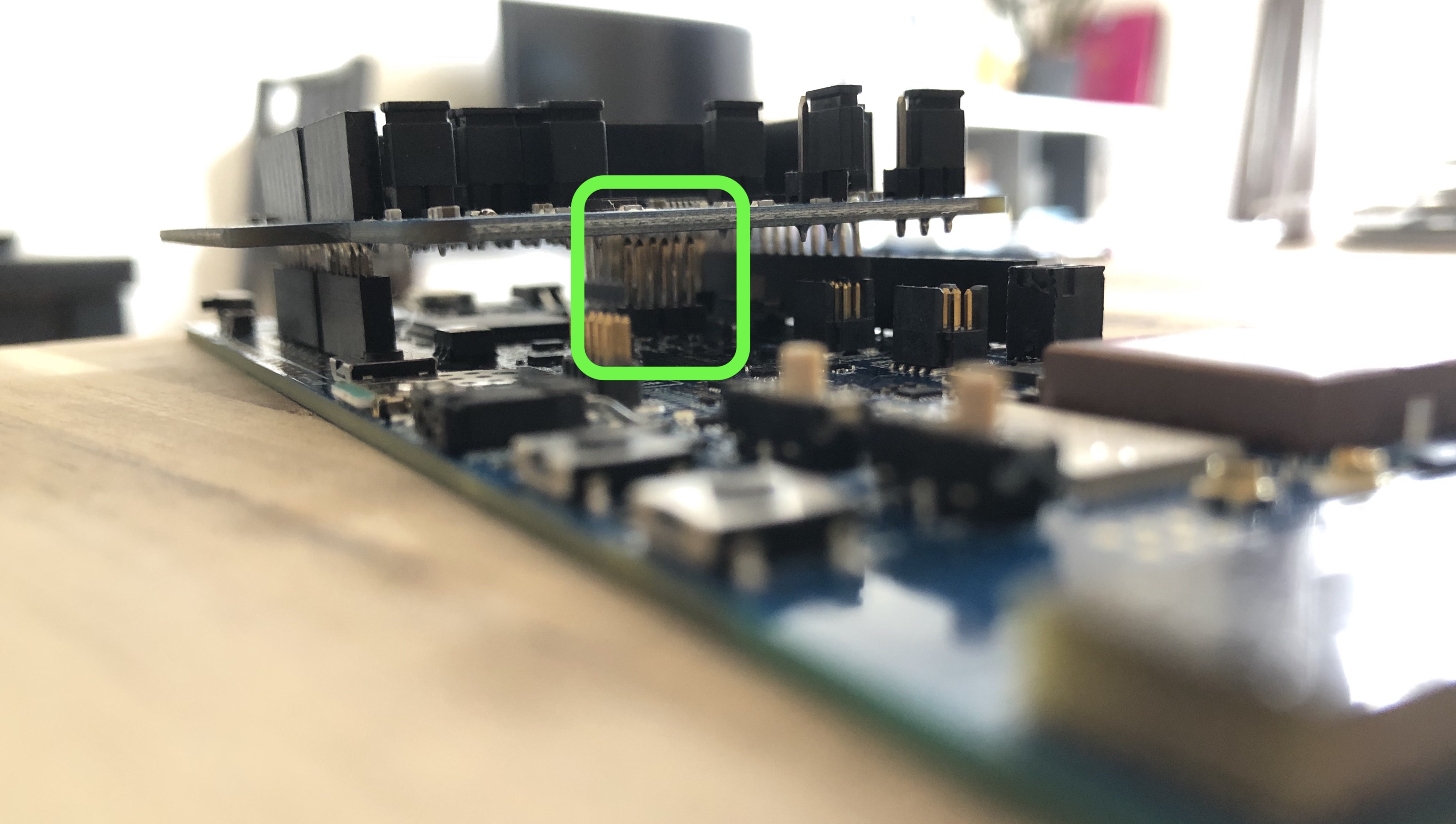 Make sure the shield does not touch any of the pins in the middle of the development board.