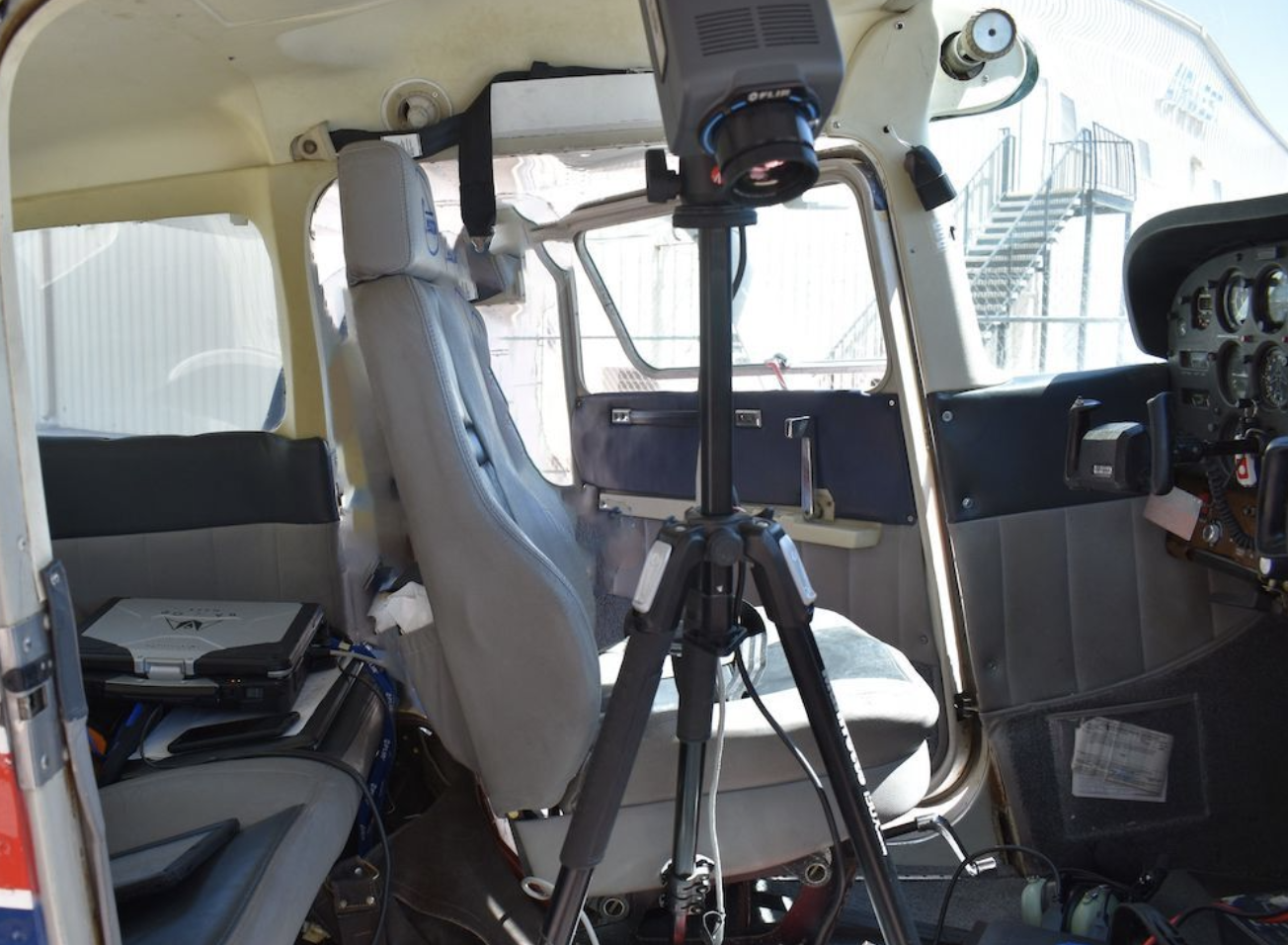Screen Shot 2021-08-02 at 6.10.39 AM.png FLIR infrared camera mounted to tripod in cabin. Must be secured by multiple ratchet straps of equivalent.