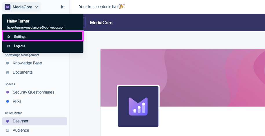 Conveyor left sidebar with the organization name menu open, showing the user's name, email, a Settings link with a gear icon, and a Log out link.