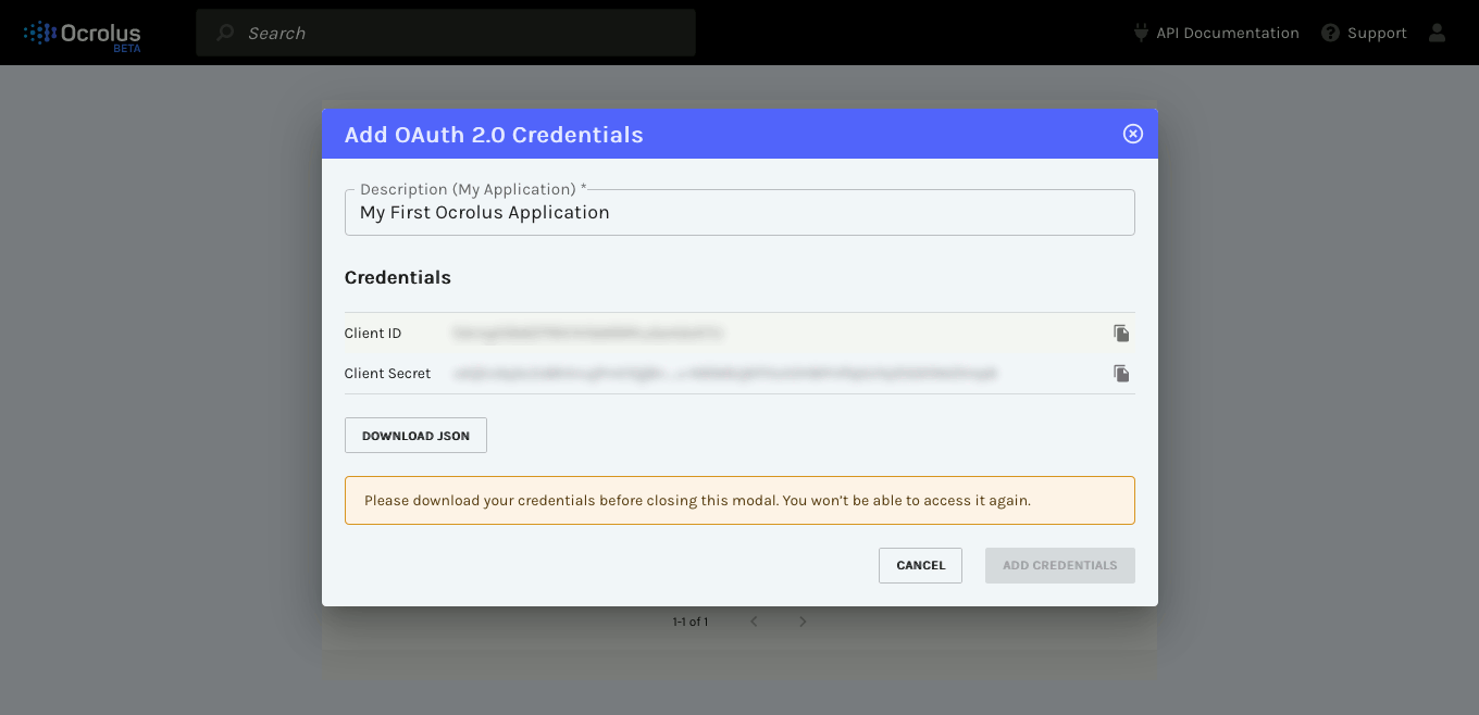 Creating a new set of credentials for an application named "My First Ocrolus Application." The client ID and secret are both blurred to indicate that these should be considered sensitive information. The "Add Credentials" button is disabled because the user has not yet used the provided "Download JSON" link.