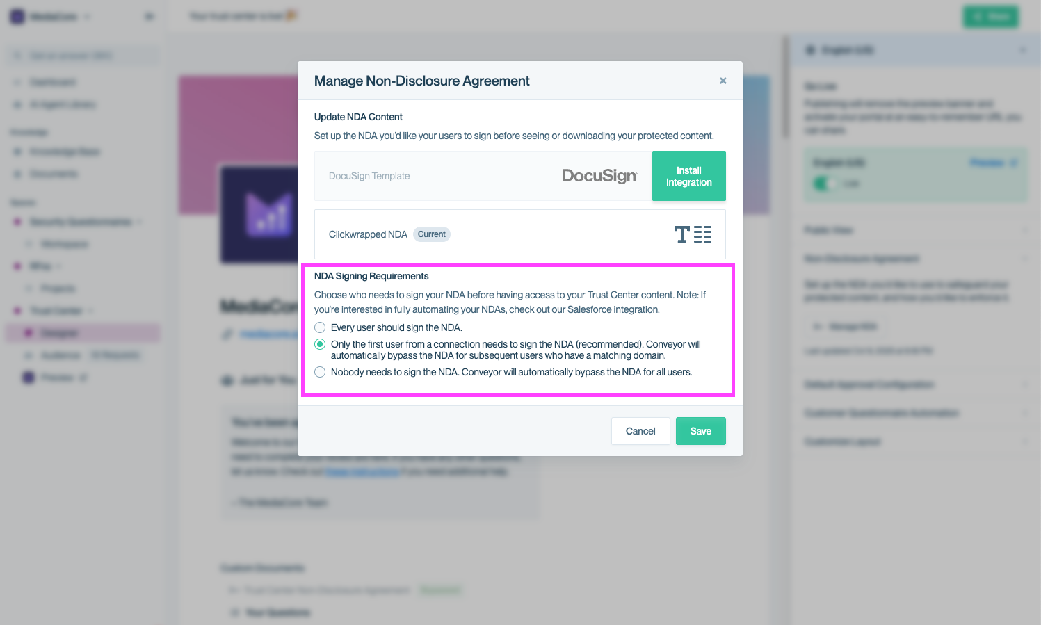 Modal window titled “Manage Non-Disclosure Agreement” showing three radio button options for NDA signing logic: every user signs, first user per domain signs (selected), or no NDA required. Save and Cancel buttons appear at the bottom.